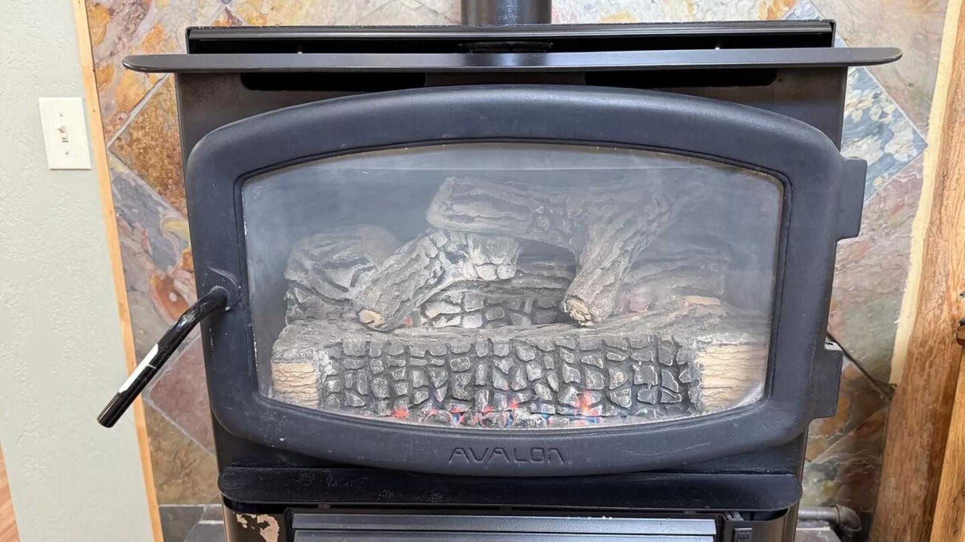 Fireplace located in the living room, make sure to bring your own wood.