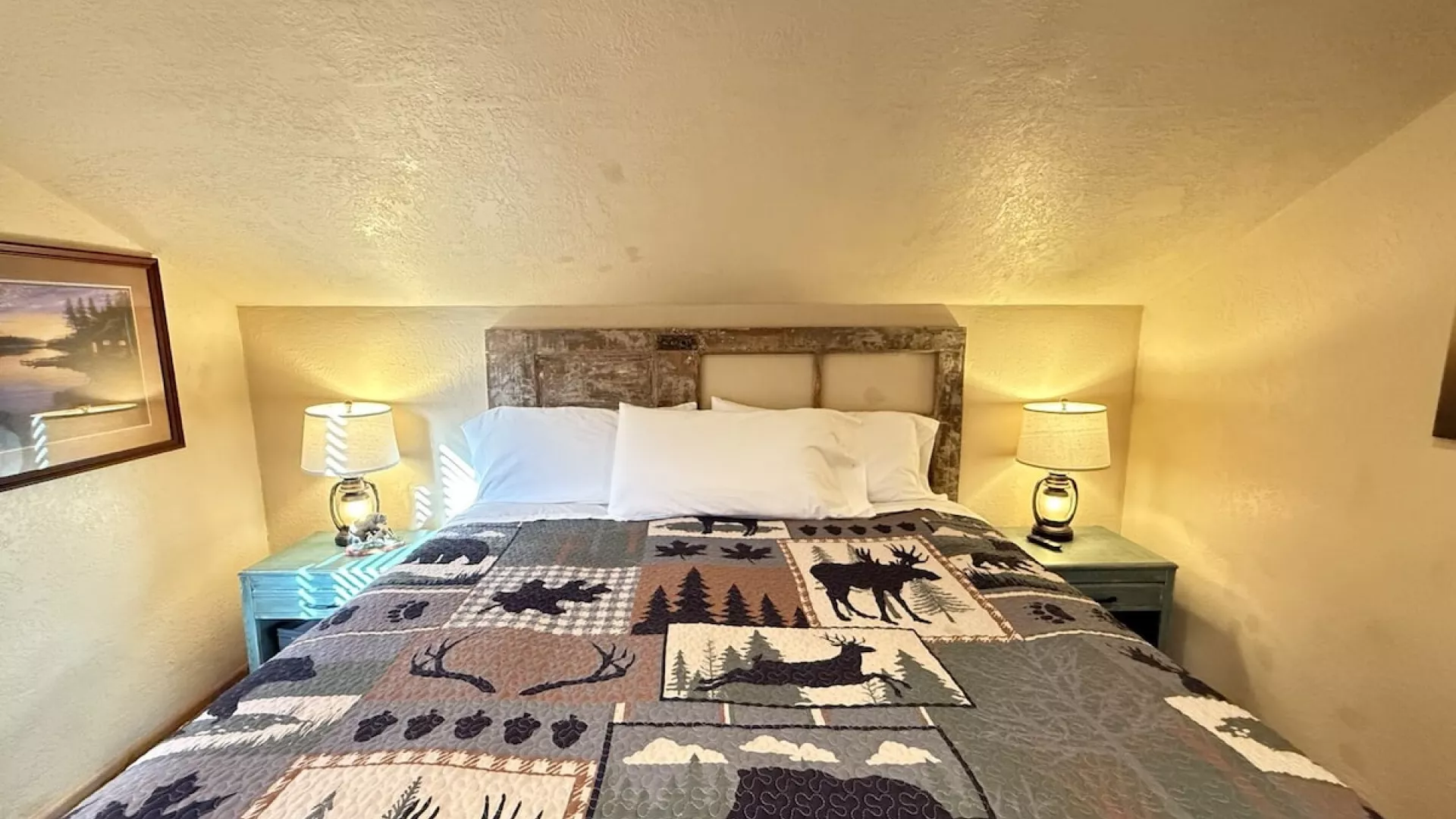 Upstairs bedroom with queen bed to comfortably sleep 2 people.