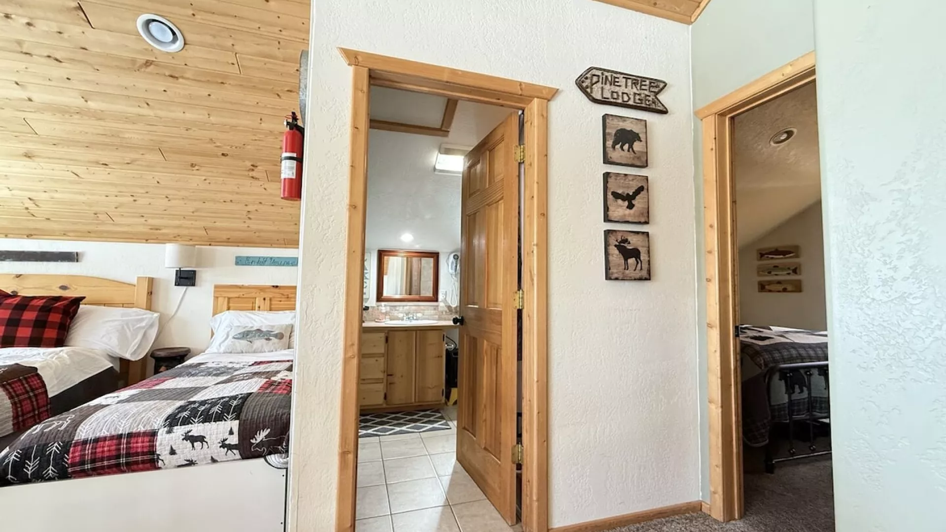From the stairs you can view the loft beds, bathrooms, and entrance to the bedrooms.