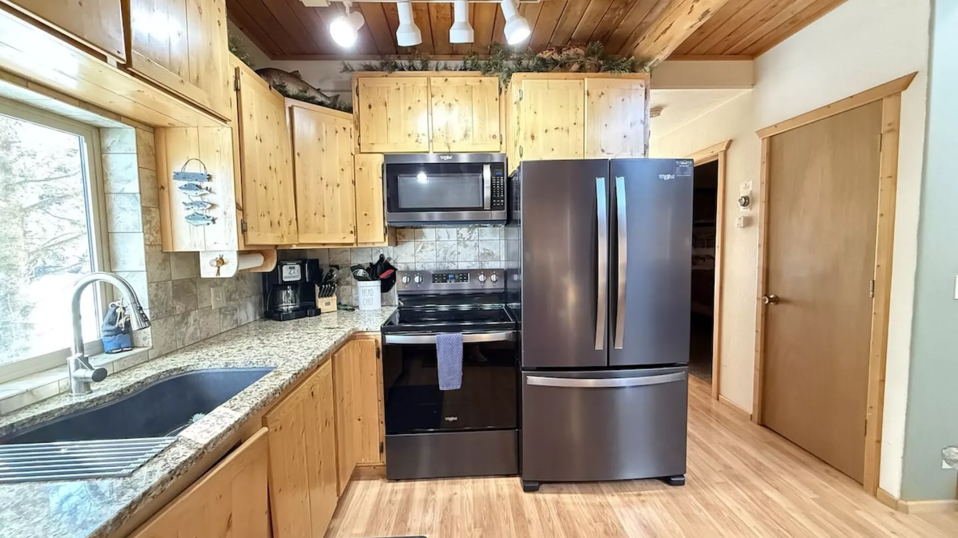 The kitchen lets in lots of natural light.