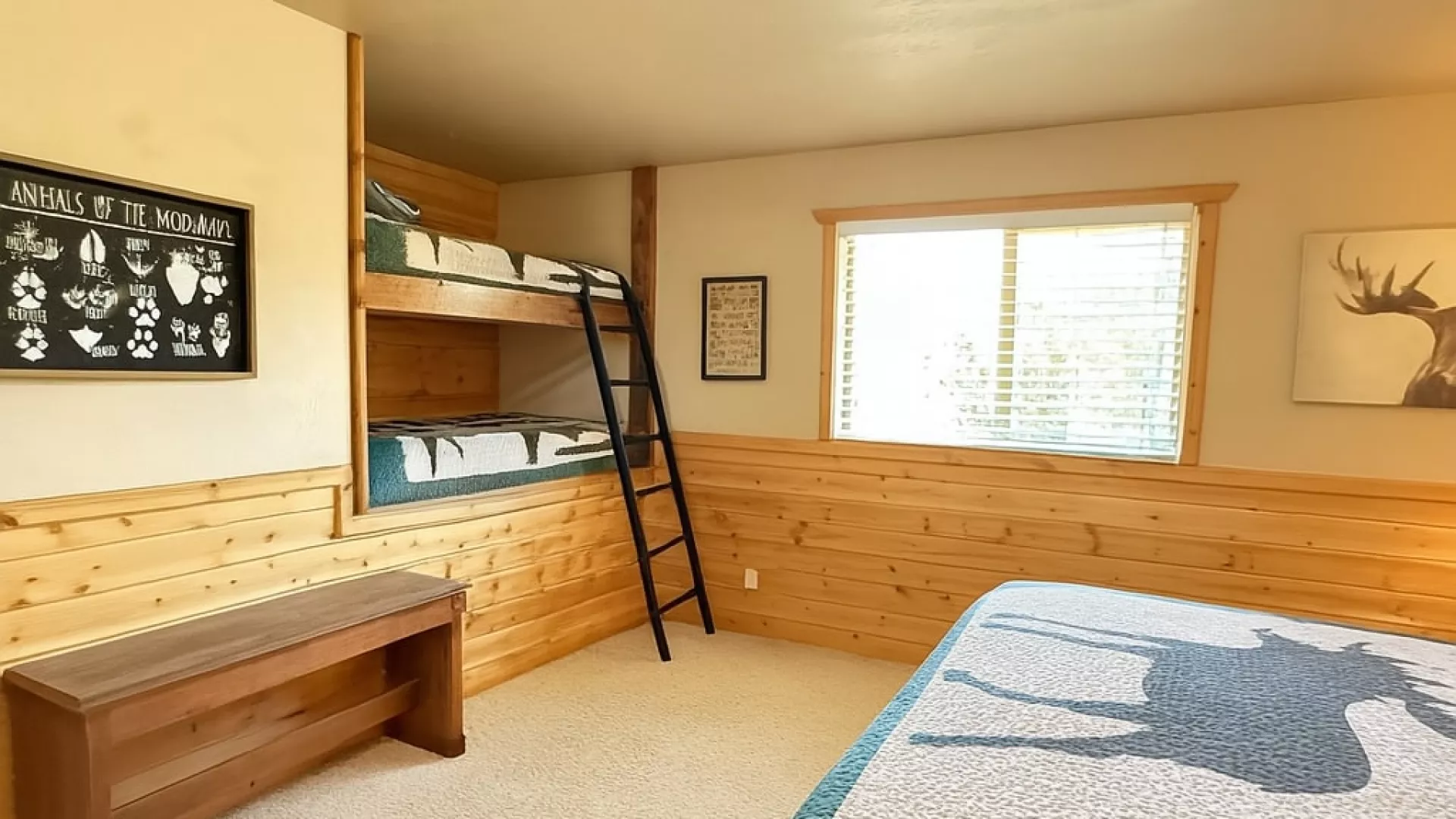 This room is equipped with a queen bed and a built in bunk bed with 2 twin beds.