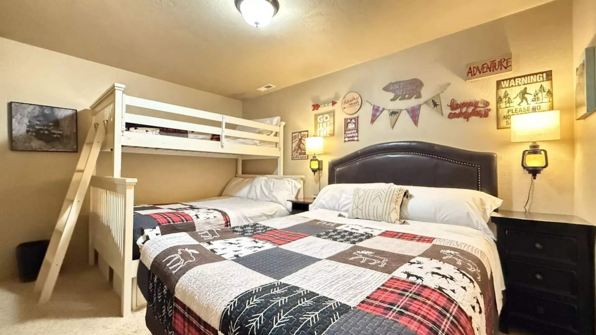 Downstairs bedroom #2, perfect for up to 5 people. This room features a queen bed and a bunk bed with a twin and double bed.