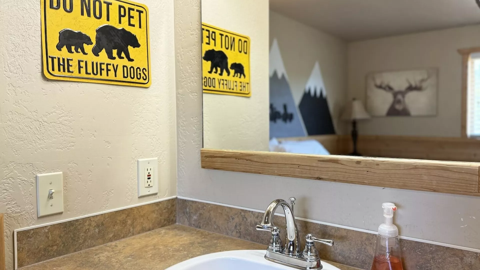 Sink and hand towel is located in this bedroom.