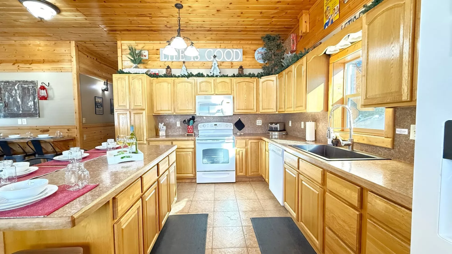 This kitchen is equipped with full appliances, basic cookware, dishes, and spices.