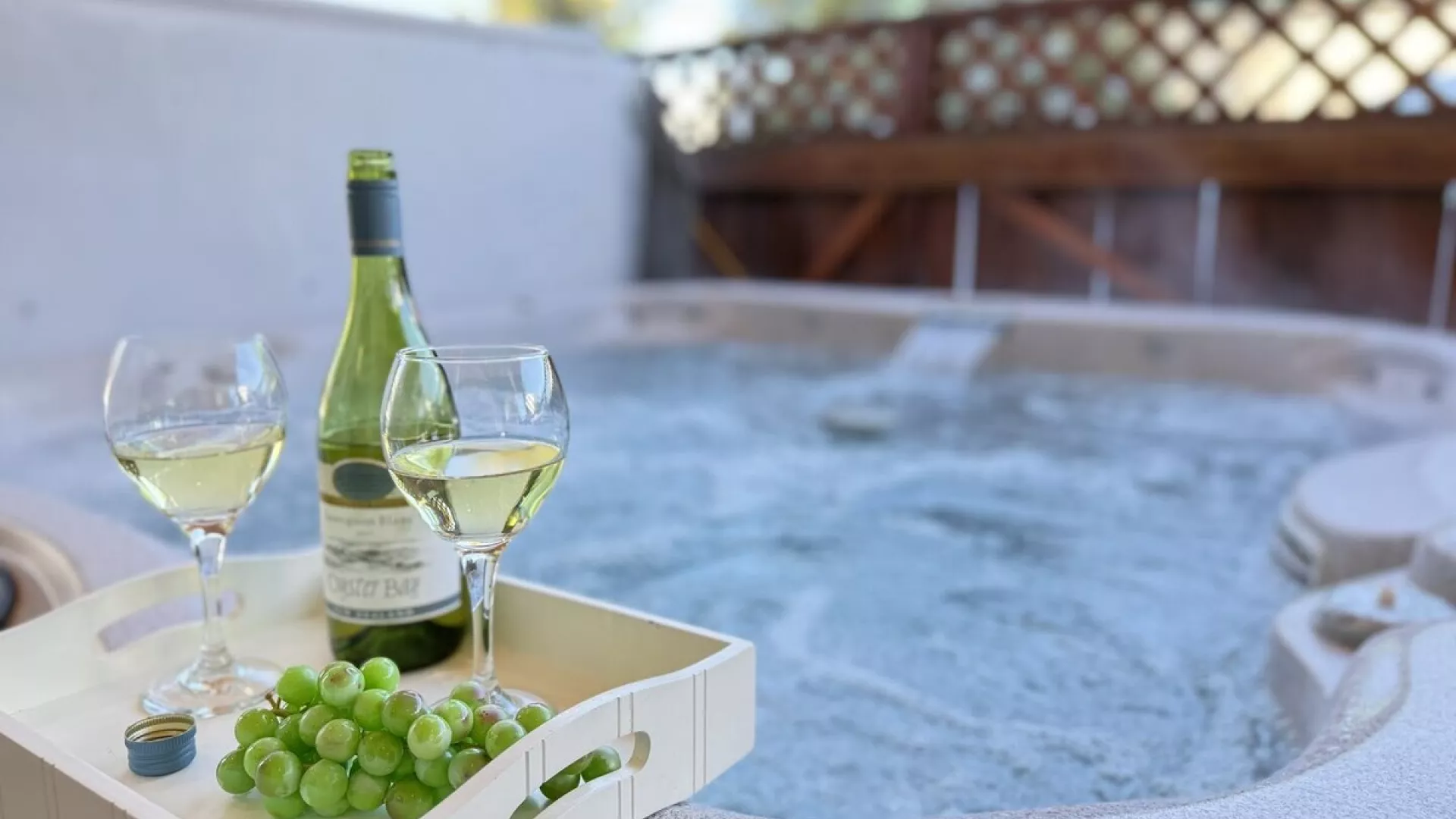 Unwind and relax in the hot tub that is located outside cabin.