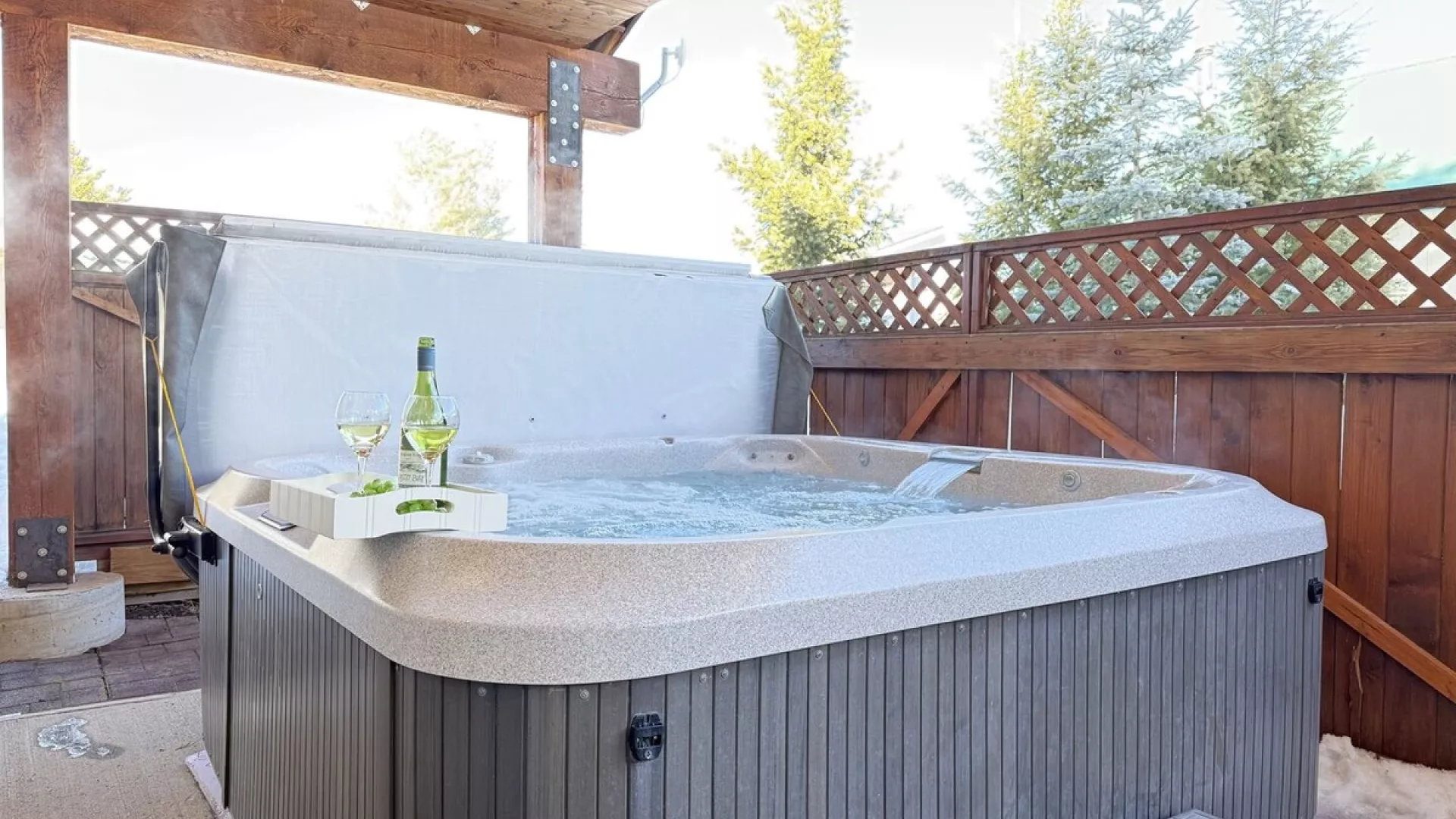 Relax after a long day in the hot tub located through the back door.