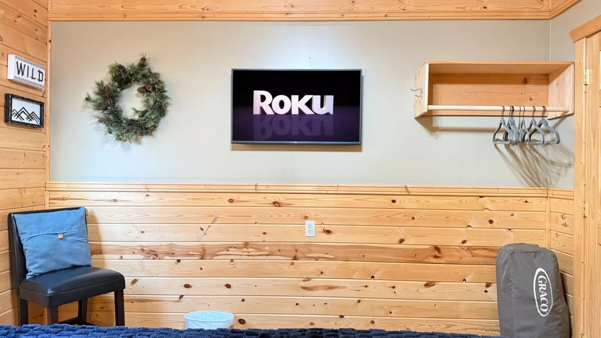 Across from the bed is a flat-screen TV—simple, unobtrusive, ready for late-night movies or quiet mornings.