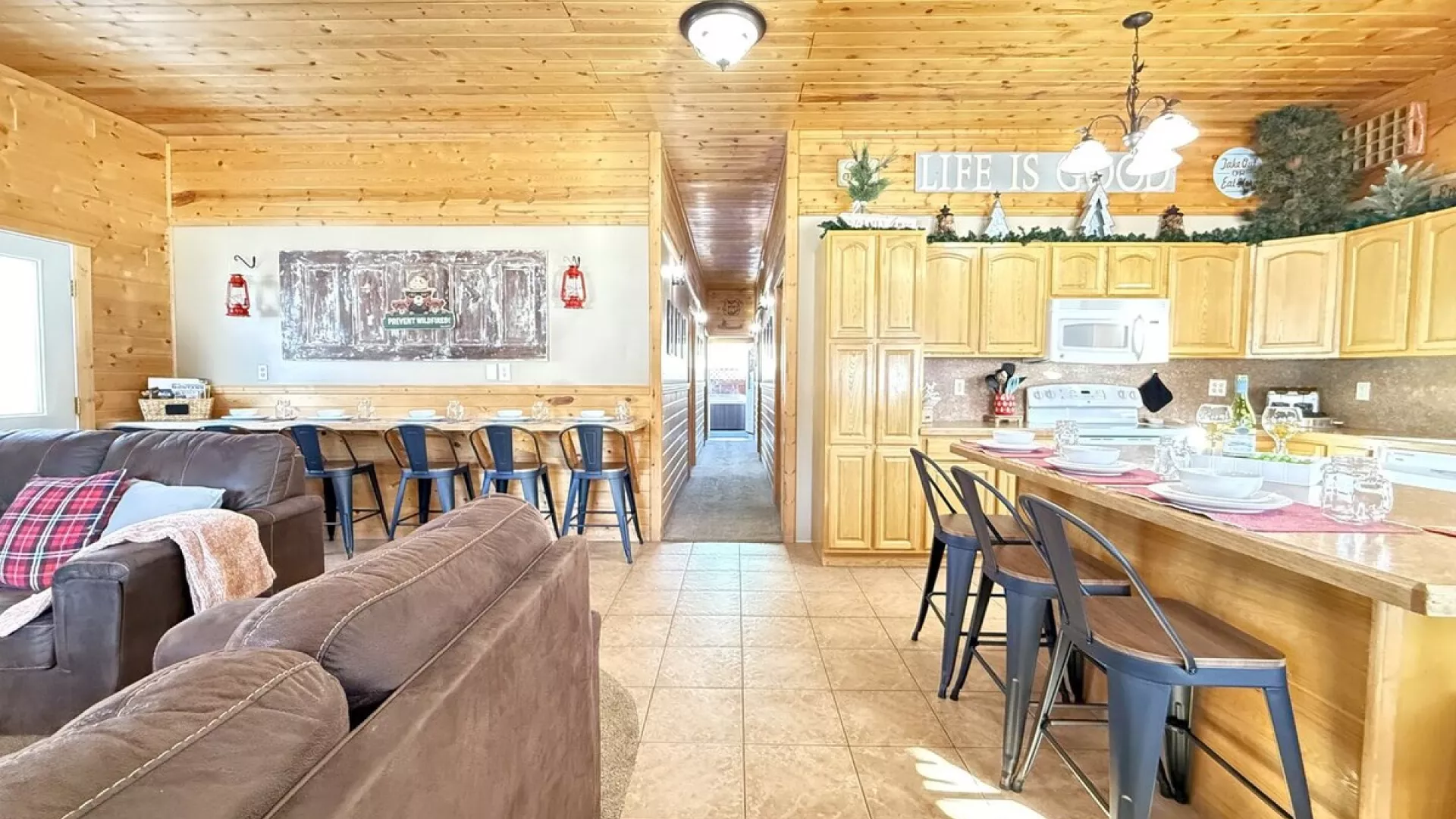 View from the entryway highlighting the open concept of kitchen and living area.
