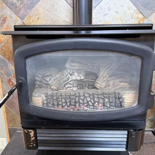 Fireplace located in the living room, make sure to bring your own wood.