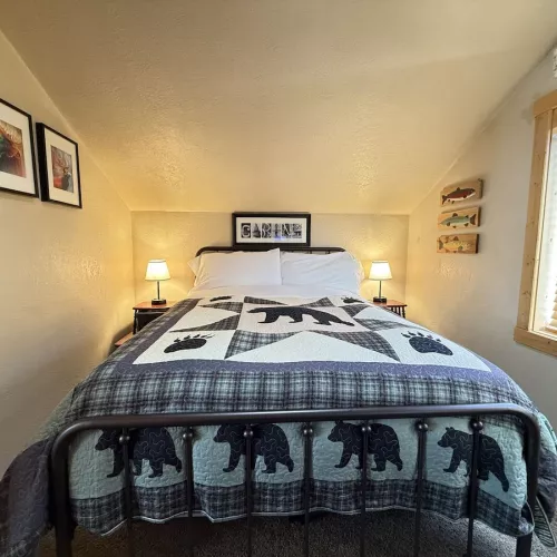 Upstairs bedroom with a queen bed.