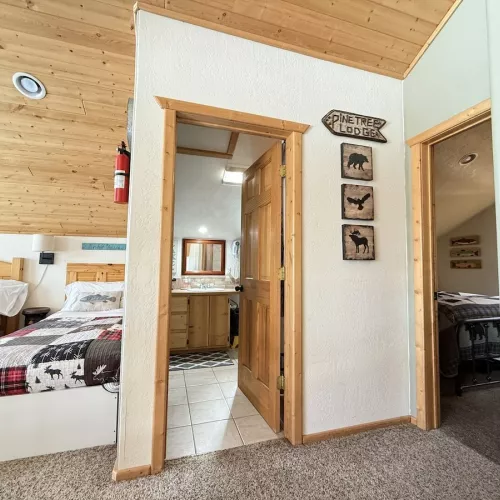 From the stairs you can view the loft beds, bathrooms, and entrance to the bedrooms.