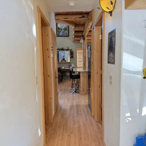 The hallway that leads you from the back door to the main area of the cabin.
