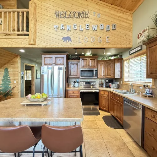 Full kitchen with appliances, cookware, dishes, silverware, and basic spices.