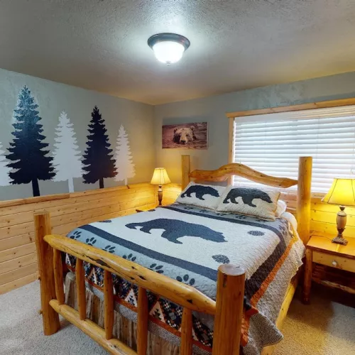 Room is equipped with a queen bed.
