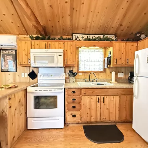 Full kitchen with appliances, cookware, dishes, silverware, and basic spices.