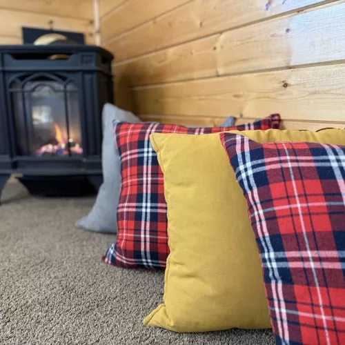 Relax by the fire in the cozy living room.