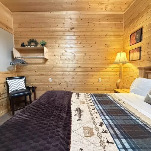 Imagine a cozy cabin bedroom that instantly makes you want to curl up and stay awhile.