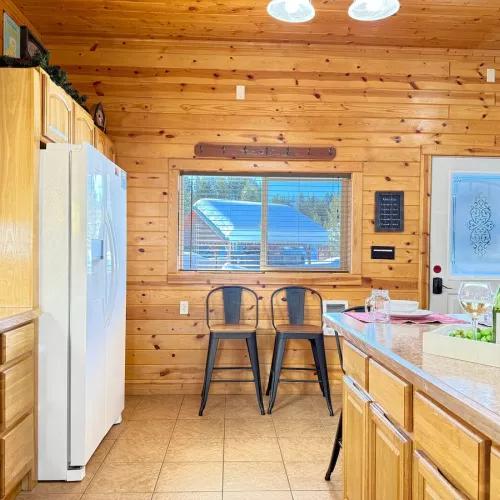 The open layout of the kitchen blends seamlessly into the other areas of the cabin.