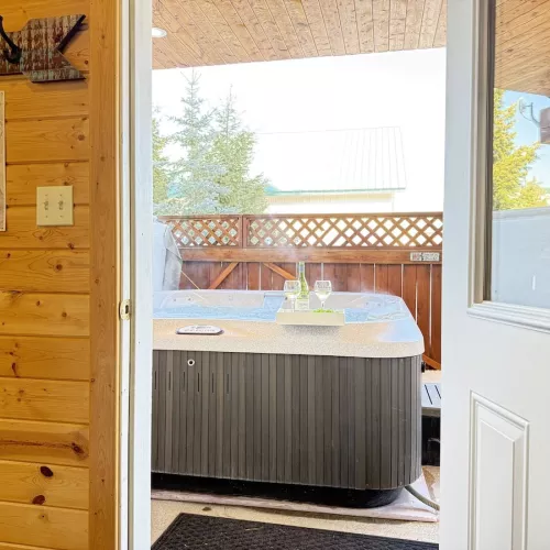 Walk out back to enjoy the hot tub available year round.