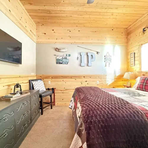 Imagine a cozy cabin bedroom that instantly makes you want to curl up and stay awhile.