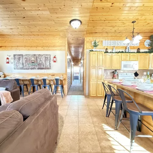 View from the entryway highlighting the open concept of kitchen and living area.