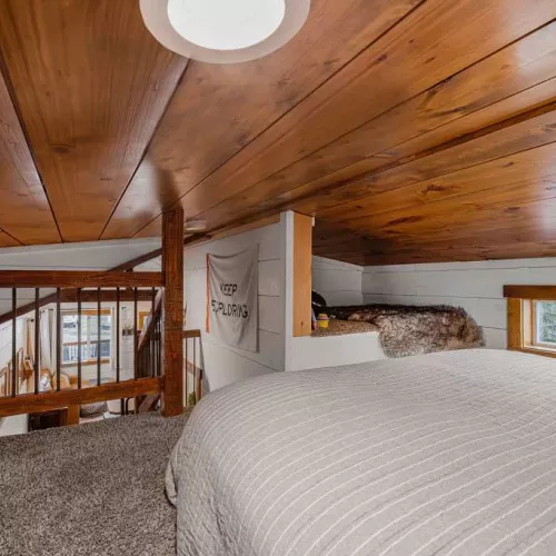 Queen bed in the open loft area.
