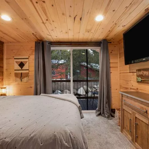 The main level bedroom has a small private porch.